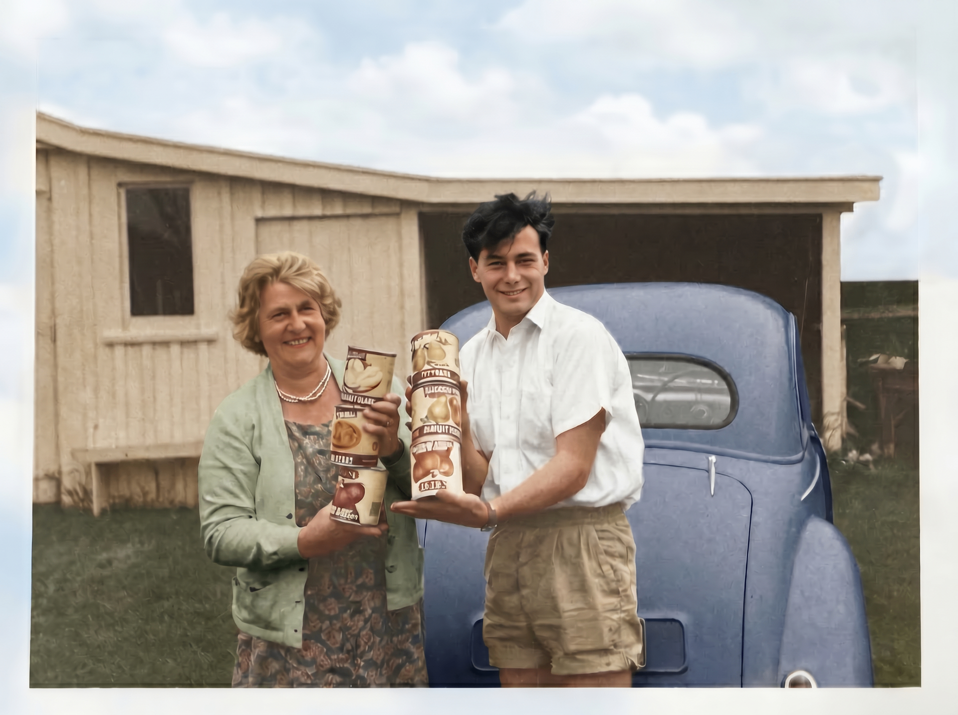 Restored photo after FixPix — A proud haul by the car — brought back in full colour