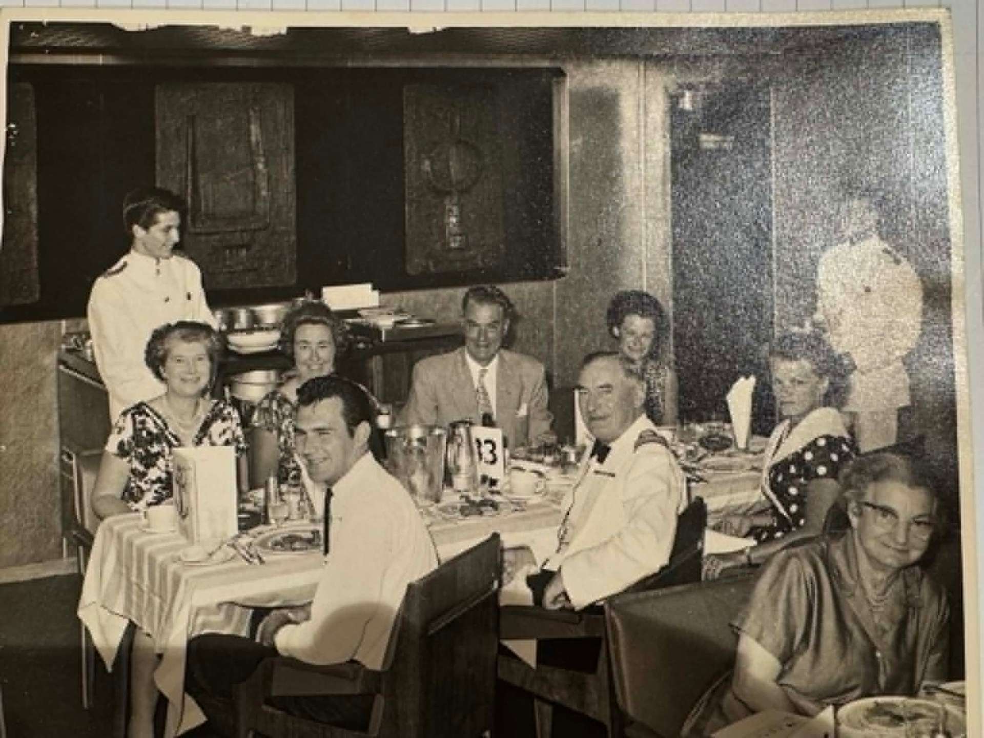 Original photo before FixPix restoration — Captain's table dinner — color brought back to life
